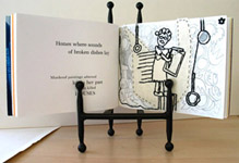 Houses, a mixed media Artist's book by Carol Es - showing letterpress page with embroidered drawing