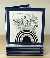 Scribbles in a Sandstorm - Artist's book by Carol Es - cover on stack of other books